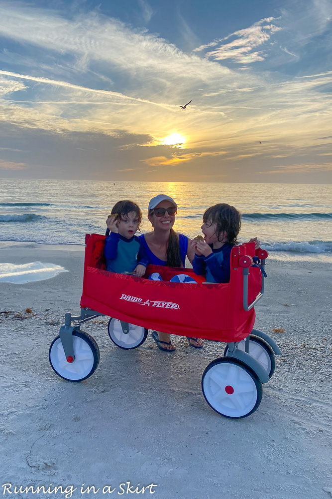 Mom with twins at sunset.