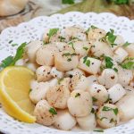 Bay Scallops recipe on a white plate.