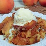Crock Pot Peach Cobbler with Cake Mix on a plate.