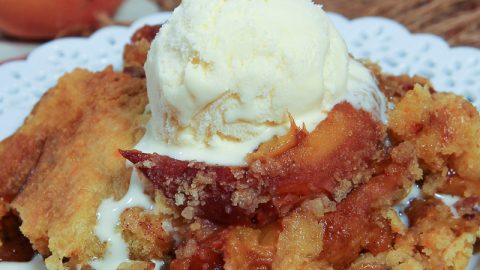 Crock Pot Peach Cobbler with Cake Mix on a plate.